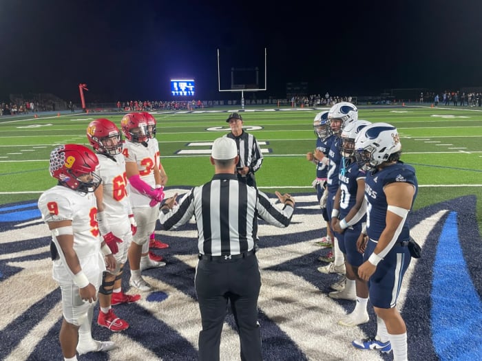 The coin toss before the game Friday.